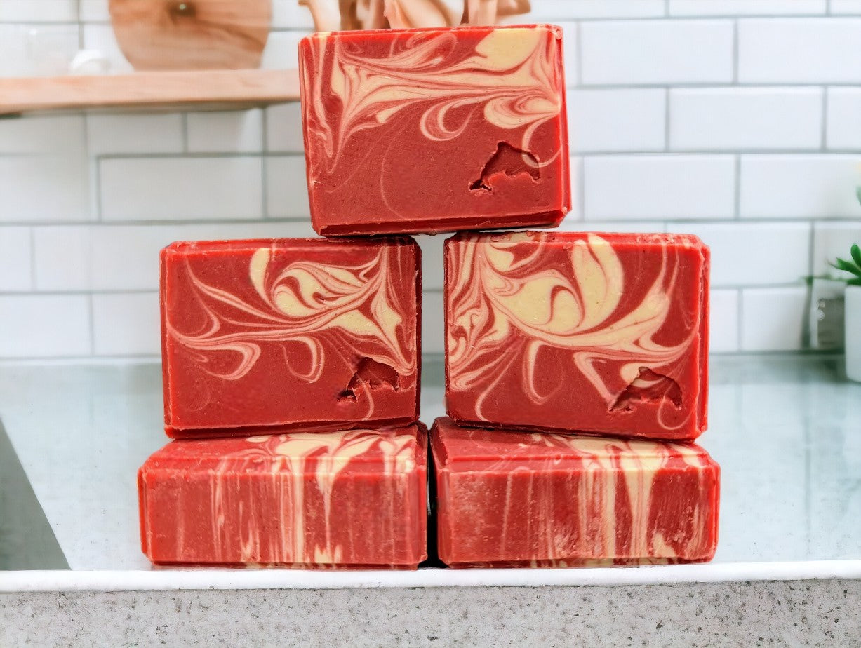 Cold processed soap bar with strawberry red main color with white swirls.  Features Avocado Oil, Colloidal Oats and Kaolin Clay.  Fresh Picked Strawberry fragrance oil. 