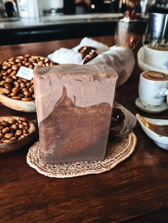 Cafe Mocha Coffee soap - part of our Coffee Soap Collection.  Top is a creamy light tan color with brown base that looks like aged leather on some bars.  Goat milk, Colloidal oats and coffee are some of the skin loving ingredients in this bubbly bar soap.