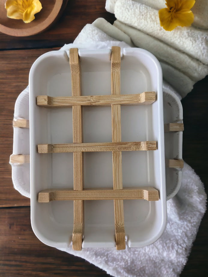 100% natural Soap Saver Dish -- crafted from bamboo, bamboo fiber, and corn starch! White base with bamboo inset. It looks great in the kitchen or the bathroom, and it's easy to clean. Most importantly it'll help keep your soap dry and high, which helps make sure your soap will last. Environment-friendly and a small but impactful way to reduce our eco-footprint!