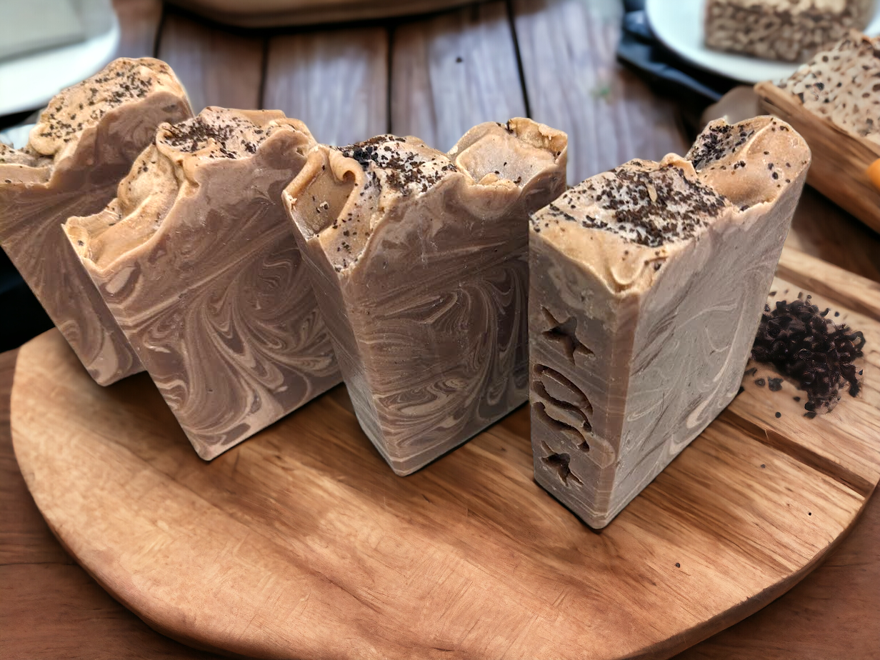 The perfect gift for the coffee lover in your life!!  Wake up their morning shower routine with Café au Lather! Gentle natural brown with delicate and creamy swirls, with a pinch of coffee grinds on top for a gentle exfoliation. An invigorating blend of real coffee and Fresh Brewed Coffee fragrance oil and loaded with skin loving ingredients, this all natural and handcrafted soap bar is sure to please!