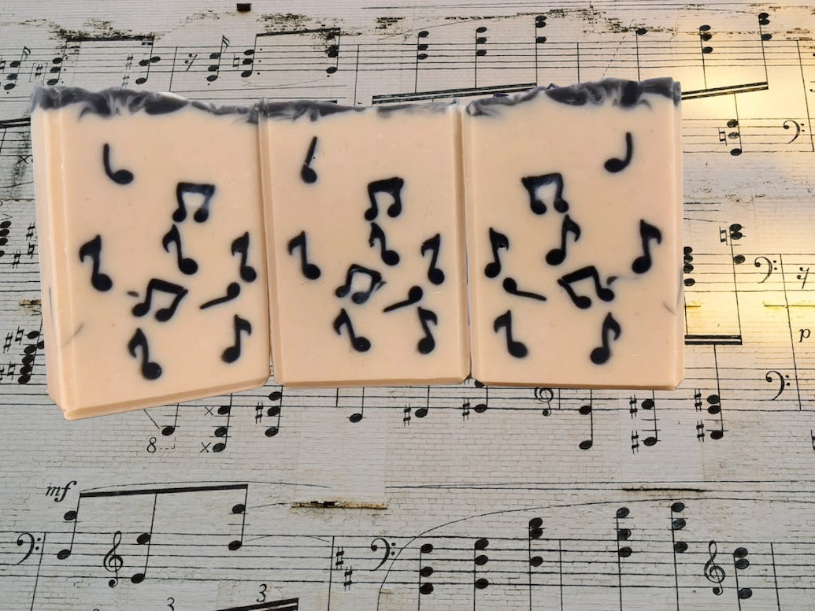 Delightful Tallow Bar Soap with Musical Notes embedded throughout.  Crafted in small batches with goat's milk and a light Bamboo and Teakwood scent along with other skin lovin' ingredients, it's sure to be a hit with music lovers.