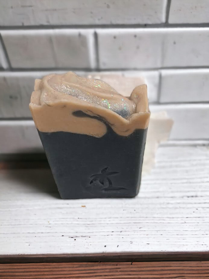 Simple and revitalizing cold processed bar soap with ocean blue base and white 'surf' top with a sparkly top. Called Sea Breeze because it's scented with a fresh and invigorating scent that has hints of ozonic ocean tide beating against a rocky shoreline. Perfect gift for the sea lover in your life.