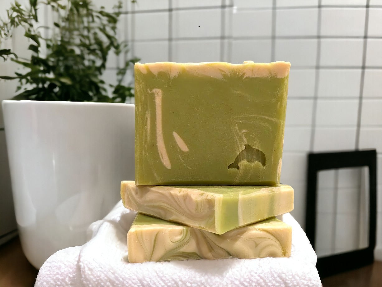 Lime green small travel or guest sized bar soap with cream swirl accents. Scented with Key Lime Pie fragrance oil.  Each stamp is stamped with dolphins, sea horses or clown fish.  Soap features Hemp Oil, Shea Butter, Goat Milk, Kaolin clay and colloidal oats.