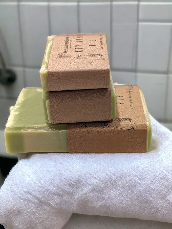 Lime green soap with cream swirl accents. Scented with Key Lime Pie fragrance oil.  Each stamp is stamped with dolphins, sea horses or clown fish.  Soap features Hemp Oil, Shea Butter, Goat Milk, Kaolin clay and colloidal oats. Available in regular, small and travel / guest sized bars.