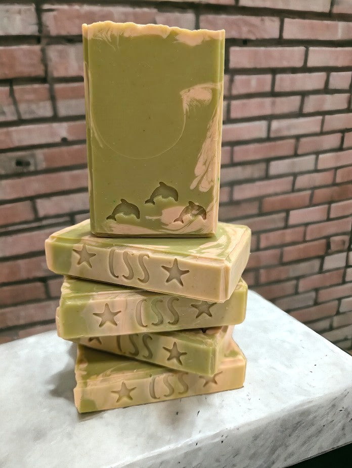 Lime green regular sized soap with cream swirl accents. Scented with Key Lime Pie fragrance oil.  Each stamp is stamped with dolphins, sea horses or clown fish.  Soap features Hemp Oil, Shea Butter, Goat Milk, Kaolin clay and colloidal oats. 