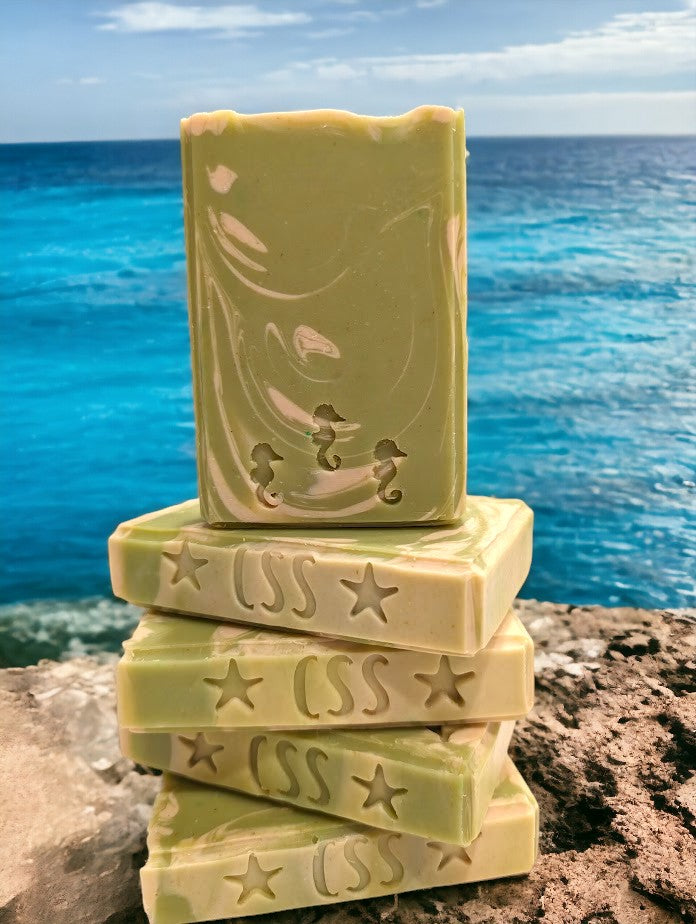 Lime green regular sized soap with cream swirl accents. Scented with Key Lime Pie fragrance oil.  Each stamp is stamped with dolphins, sea horses or clown fish.  Soap features Hemp Oil, Shea Butter, Goat Milk, Kaolin clay and colloidal oats. 