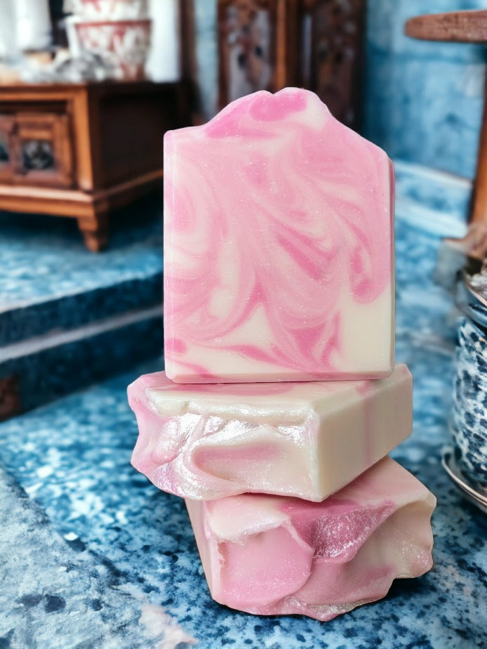 Marvel at the sophisticated swirly design of this Pink and white Rose Quartz bar soap! You'll discover a luscious lather made with Green Tea Seed Oil and Tussah Silk and skin loving oils. Whether you prefer scented with Rose Quartz Fragrance Oil.  Dive into a soapy oasis of delight!