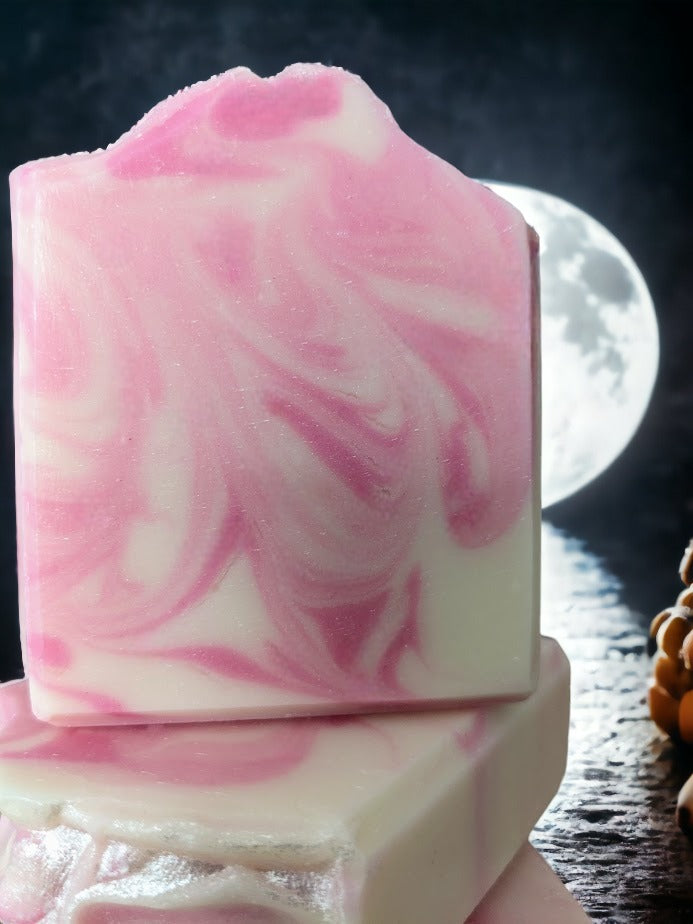 Marvel at the sophisticated swirly design of this Pink and white Rose Quartz bar soap! You'll discover a luscious lather made with Green Tea Seed Oil and Tussah Silk and skin loving oils. Whether you prefer scented with Rose Quartz Fragrance Oil. Dive into a soapy oasis!