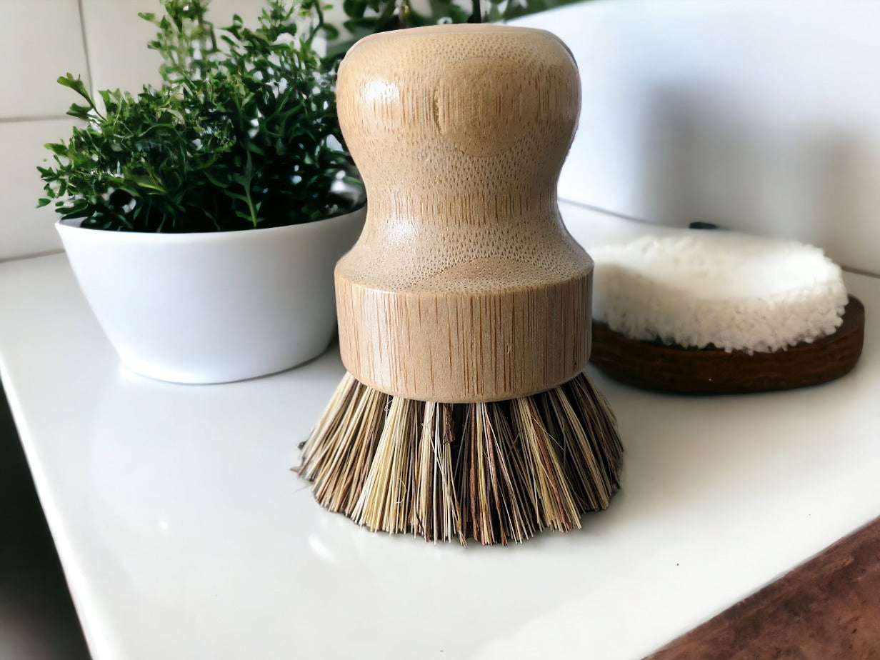 Eco-friendly bamboo dish scrubber with natural sisal bristles.  These green household scrubbers are Environmentally safe and biodegradable for the eco-conscious.