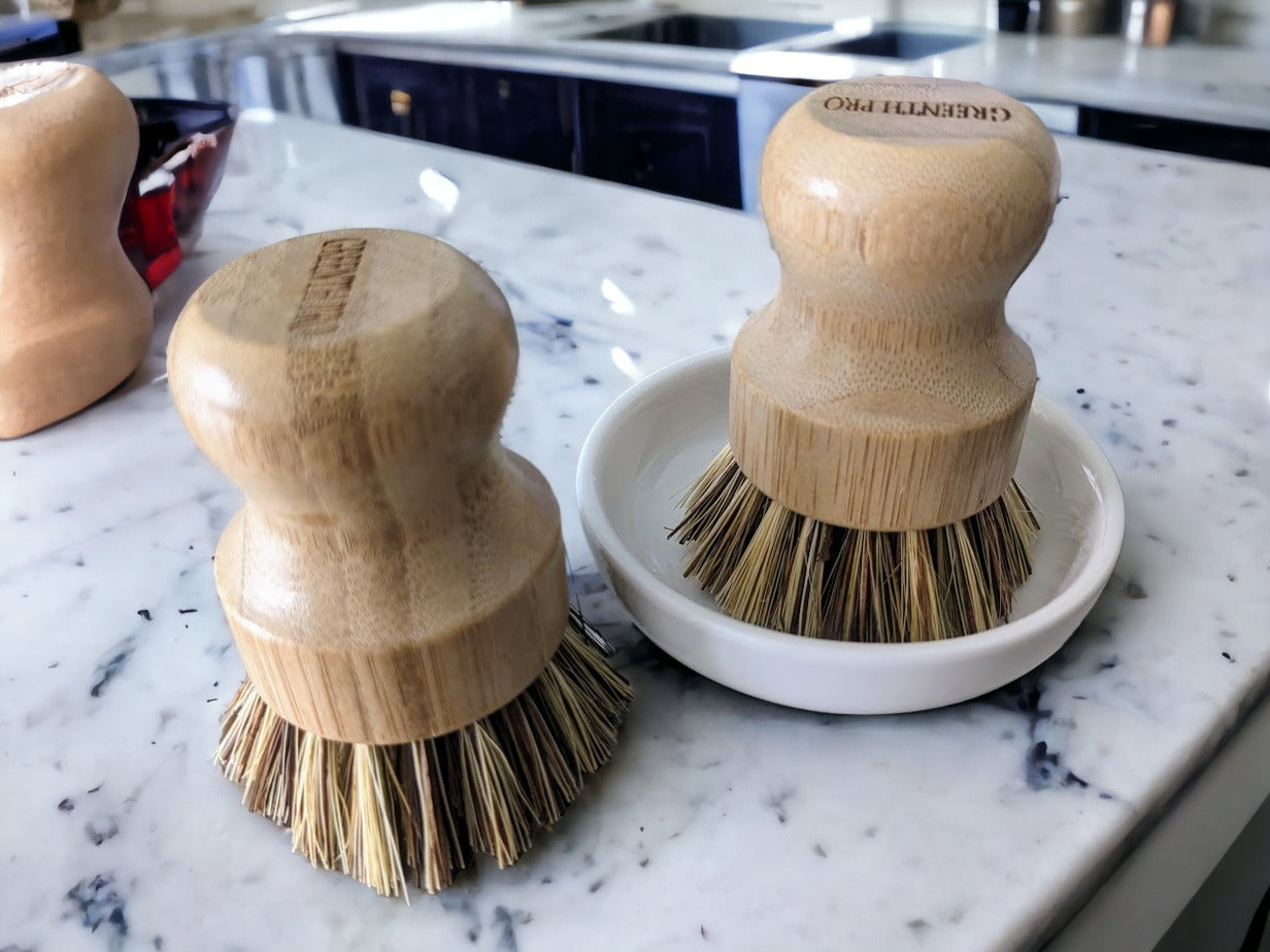 Eco-friendly bamboo dish scrubber with natural sisal bristles.  Environmentally safe and eco-conscious cleaning supplies.