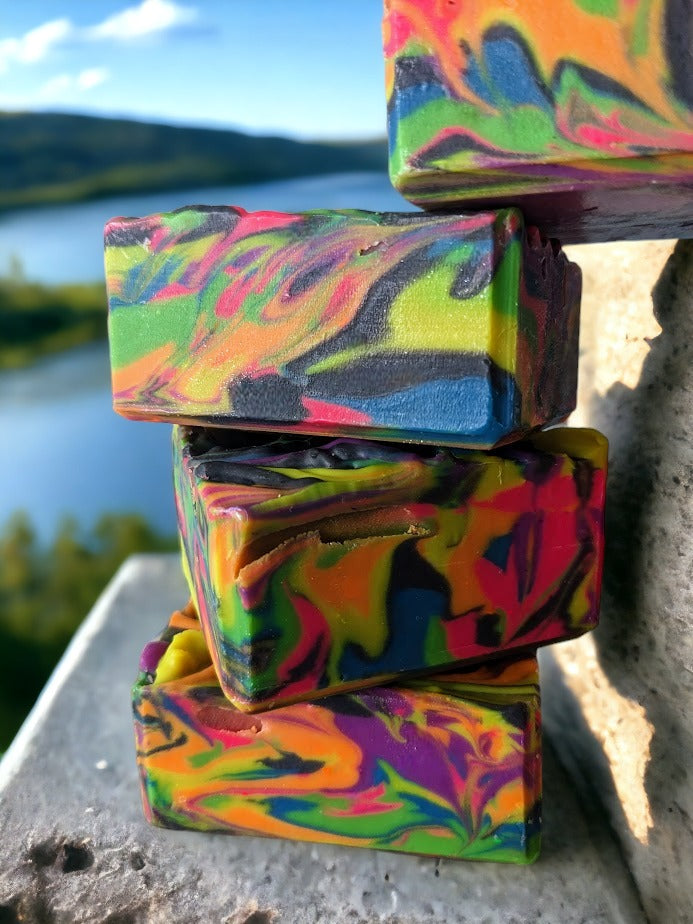 Our handmade, small batch neon soap bar is bright and bold, featuring an eye-catching neon spin swirls of pink, blue, orange, green, yellow and purple throughout the bar. Tussah Silk, Rice Bran and Avocado oils give this soap a wonderful and creamy texture.  Uncover how the soap design changes as you use it. Who knew soap could be this exciting? 