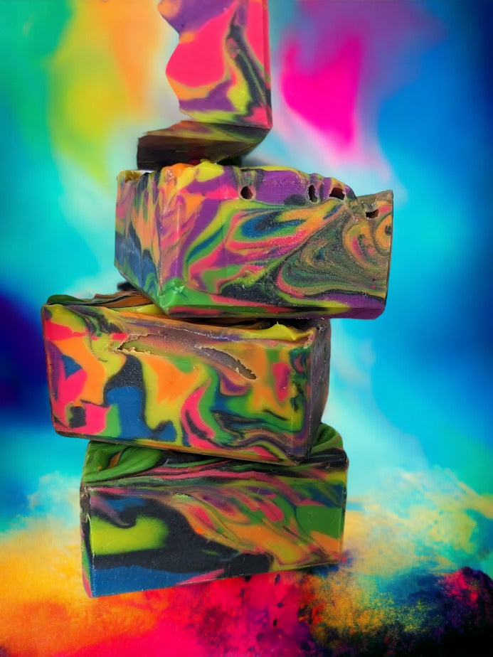 Our handcrafted, small batch neon soap bar is bright and bold, featuring an eye-catching neon spin swirls of pink, blue, orange, green, yellow and purple throughout the bar. Tussah Silk, Rice Bran and Avocado oils give this soap a creamy and dreamy texture.  Uncover how the soap design changes as you use it. Who knew soap could be this exciting? 