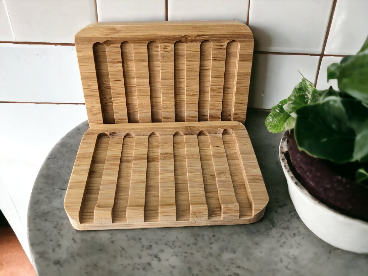 no-slip bamboo soap dish. sloped design helps water drain away and the raised edge keeps your bar of soap comfy and secure! Built to last, easy care (wipe once a week-ish)