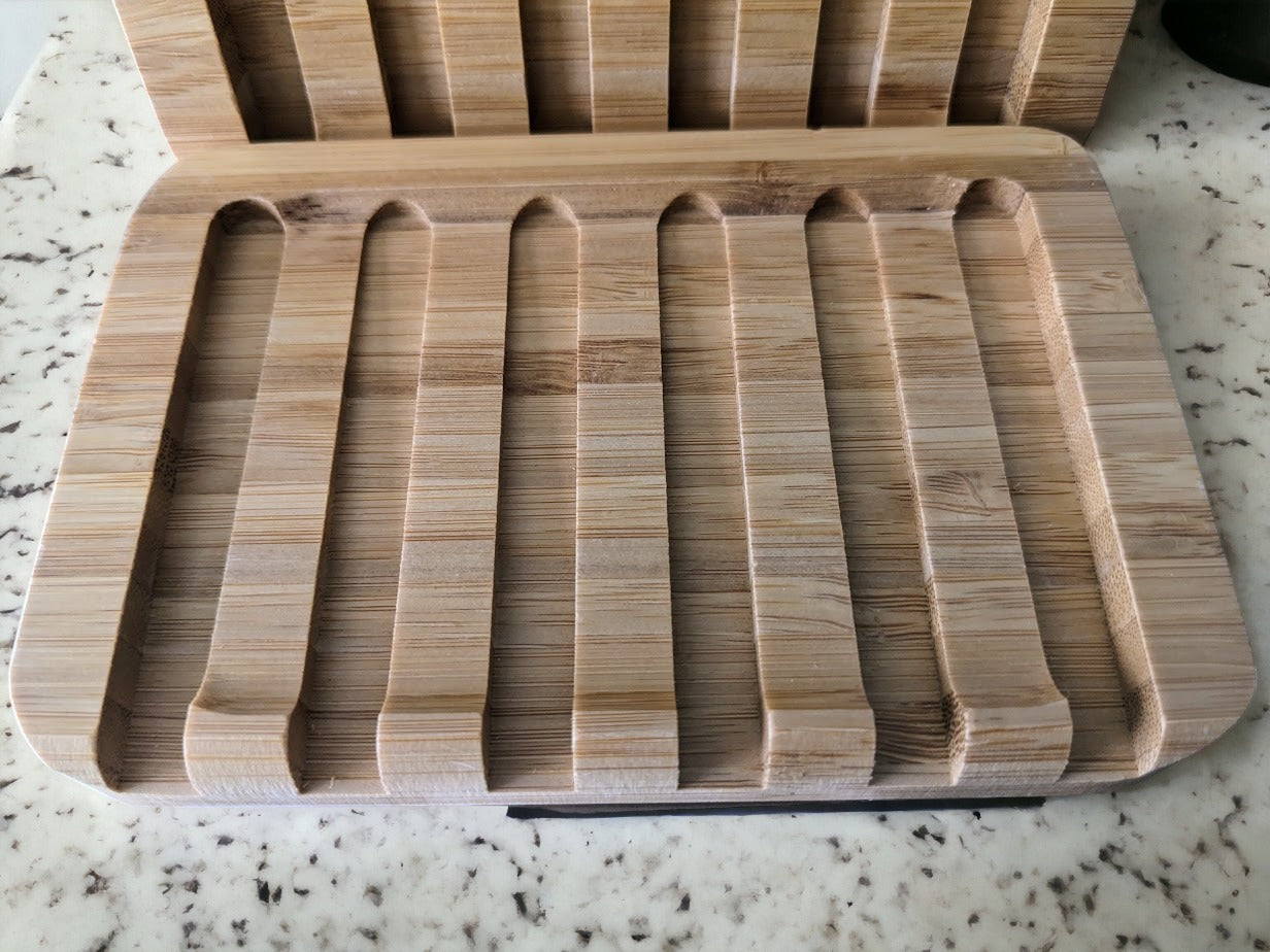 no-slip bamboo soap dish. sloped design helps water drain away and the raised edge keeps your bar of soap comfy and secure! Built to last, easy care (wipe once a week-ish)