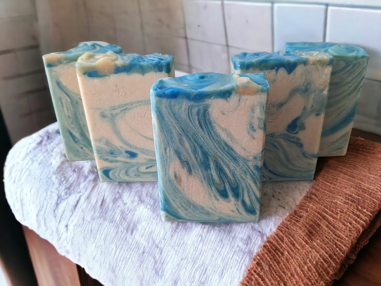 This handcrafted decorative soap it smells heavenly, and wows with its whimsical swirls of blue, creamy white and veins of gold. Every single bar of soap different in appearance. Reminiscent of an August sunset here in Florida, this beautiful soap has a fantastic sudsy lather -- bubbles galore!  The scent on this soap is divine!!  Think Amazing Grace* by Philosopy and you'll get it.  Notes of Bergamot, lemon, citron and neroli, jasmine, orange blossom and rose with touch of musk and cedarwood.