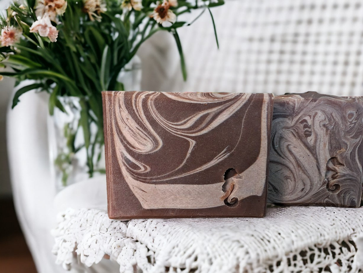 Handcrafted artisan soap featuring Hemp Oil and Goat Milk. Dark brown base with light brown swirls.  Fragranced with the much-loved Cocoa Butter Cashmere fragrance.  It's a wonderful addition to your personal care routine!! Available in 3 sizes:  Regular Bar, Small Bar and Travel / Guest / Hotel sized bars.