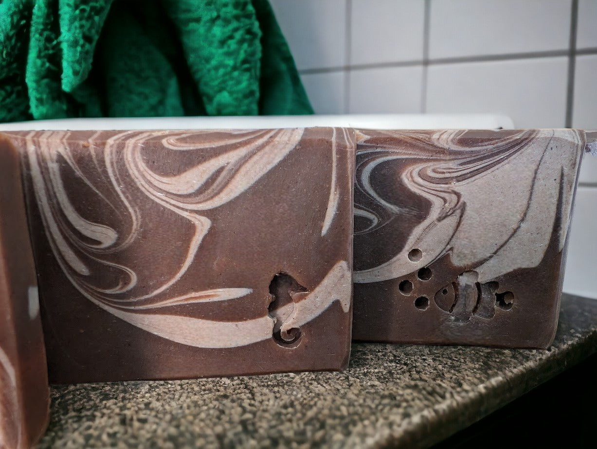 Handmade and cut artisan soap featuring Hemp Oil and Goat Milk. Dark brown base with light brown swirls.  Fragranced with the much-loved Cocoa Butter Cashmere fragrance.  It's a wonderful addition to your personal care routine!! Available in 3 sizes:  Regular Bar, Small Bar and Travel / Guest / Hotel sized bars.