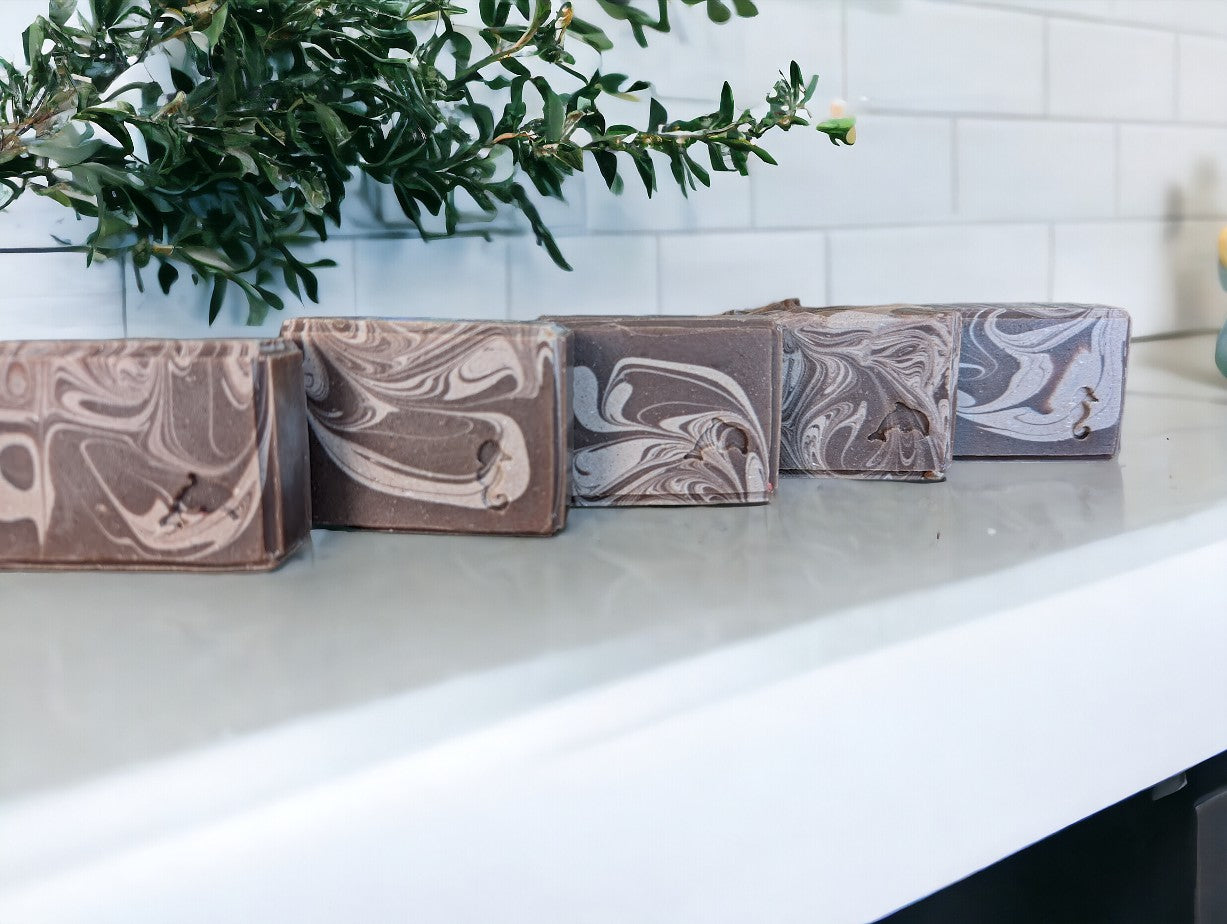 Handmade and cut artisan soap featuring Hemp Oil and Goat Milk. Dark brown base with light brown swirls.  Fragranced with the much-loved Cocoa Butter Cashmere fragrance.  It's a wonderful addition to your personal care routine!! Available in 3 sizes:  Regular Bar, Small Bar and Travel / Guest / Hotel sized bars.