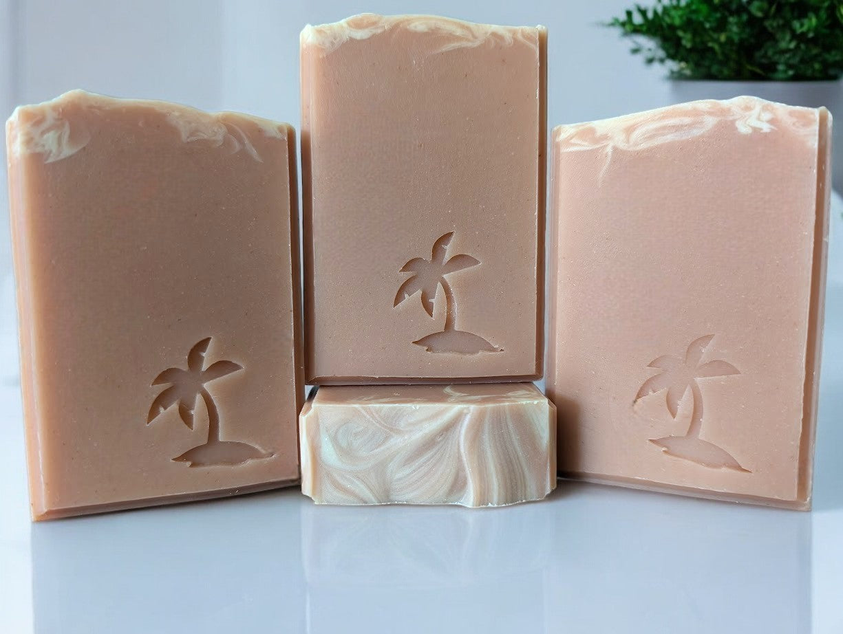 Peach colored bar soap with a palm tree stamp.  Fragranced smells just like a delectably ripe and juicy Georgia peach!! Crafted by hand with kaolin clay and colloidal oats, this bubbly soap is a perfect addition to your skin care collection.