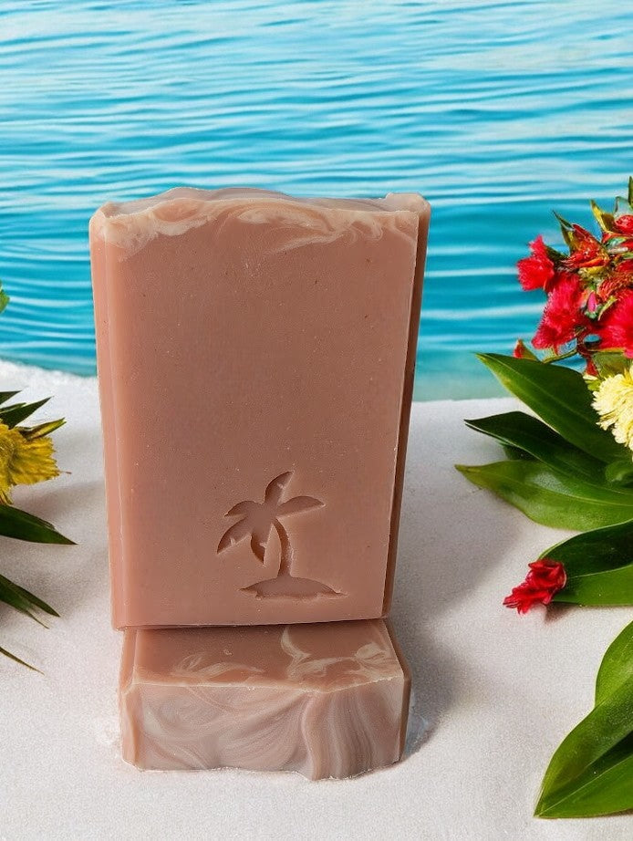 Peach colored bar soap with a palm tree stamp.  Fragrance smells just like a delectably ripe and juicy Georgia peach!! Handcrafted with kaolin clay and colloidal oats, and other skin loving ingredients, this bubbly soap is a perfect addition to your bath and body care routine.