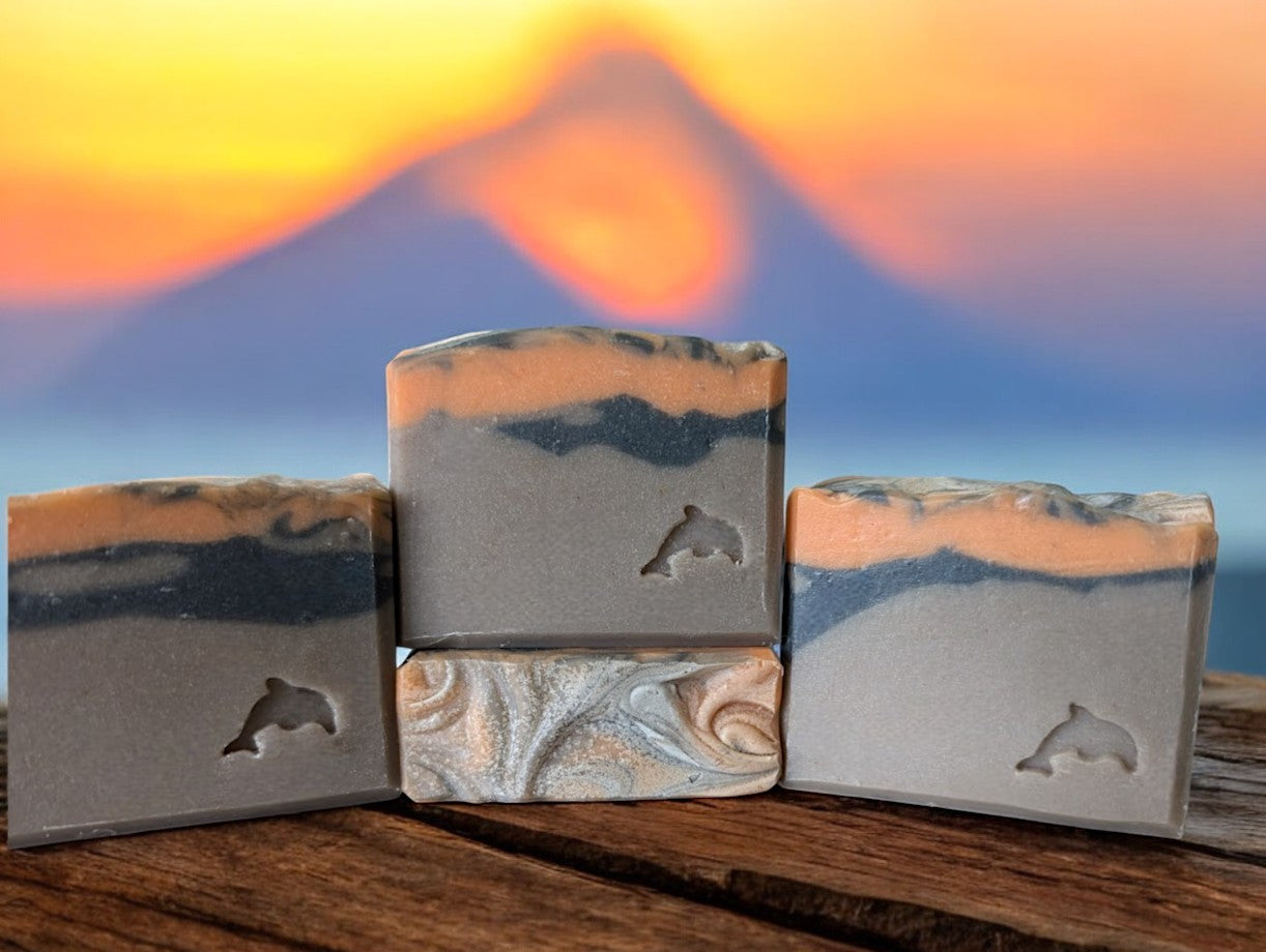 Handcrafted brown volcano goat milk soap adorned with orange and black soap (lava).This is a big bubble bar with a light luxurious lather. A must have for skin care routine. Similar to Capri Blue®'s Volcano.