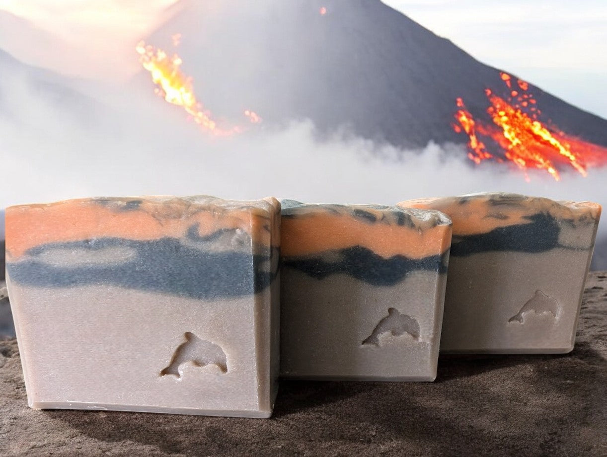 Artisan brown volcano goat milk soap adorned with orange and black soap (lava).This is a big bubble bar with a light luxurious lather. A must have for skin care routine. Similar to Capri Blue®'s Volcano.