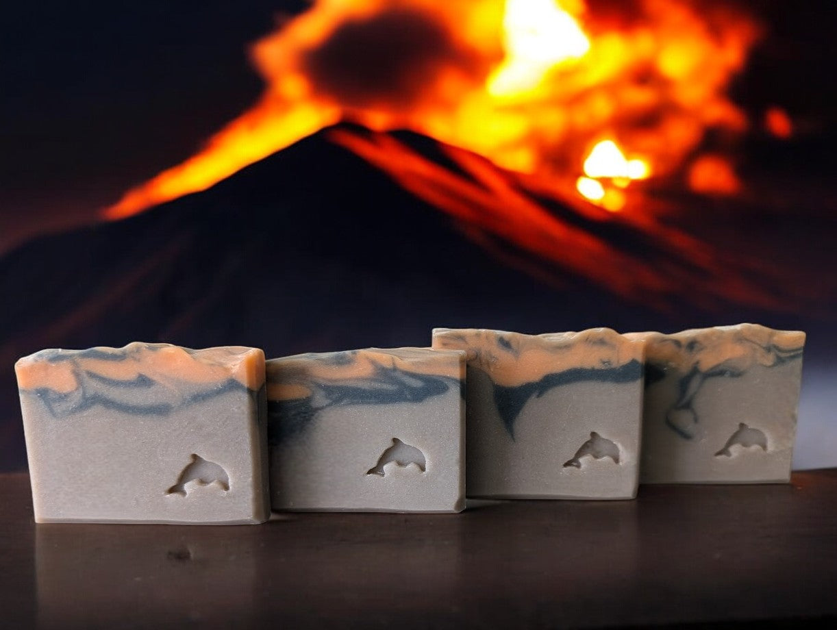 Small batch brown volcano goat milk soap adorned with orange and black soap (lava).This is a big bubble bar with a light luxurious lather. Similar to Capri Blue®'s Volcano.  Available in 3 sizes.