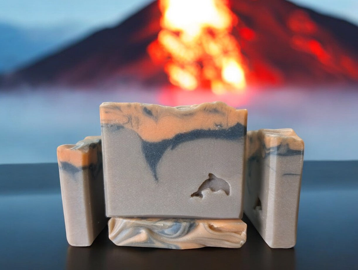 Small batch brown volcano goat milk soap adorned with orange and black soap (lava).This is a big bubble bar with a light luxurious lather. A must have for skin care routine. Similar to Capri Blue®'s Volcano.