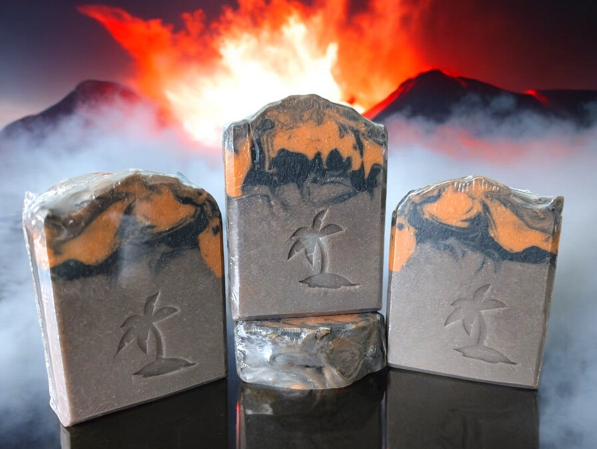 Brown volcano goat milk soap adorned with orange and black soap (lava).This is a big bubble bar with a light luxurious lather. A must have for your bath and body product collection.