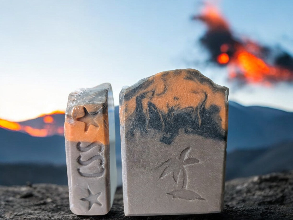 Brown volcano goat milk soap adorned with orange and black soap (lava).This is a big bubble bar with a light luxurious lather. A must have for shower care product collection.