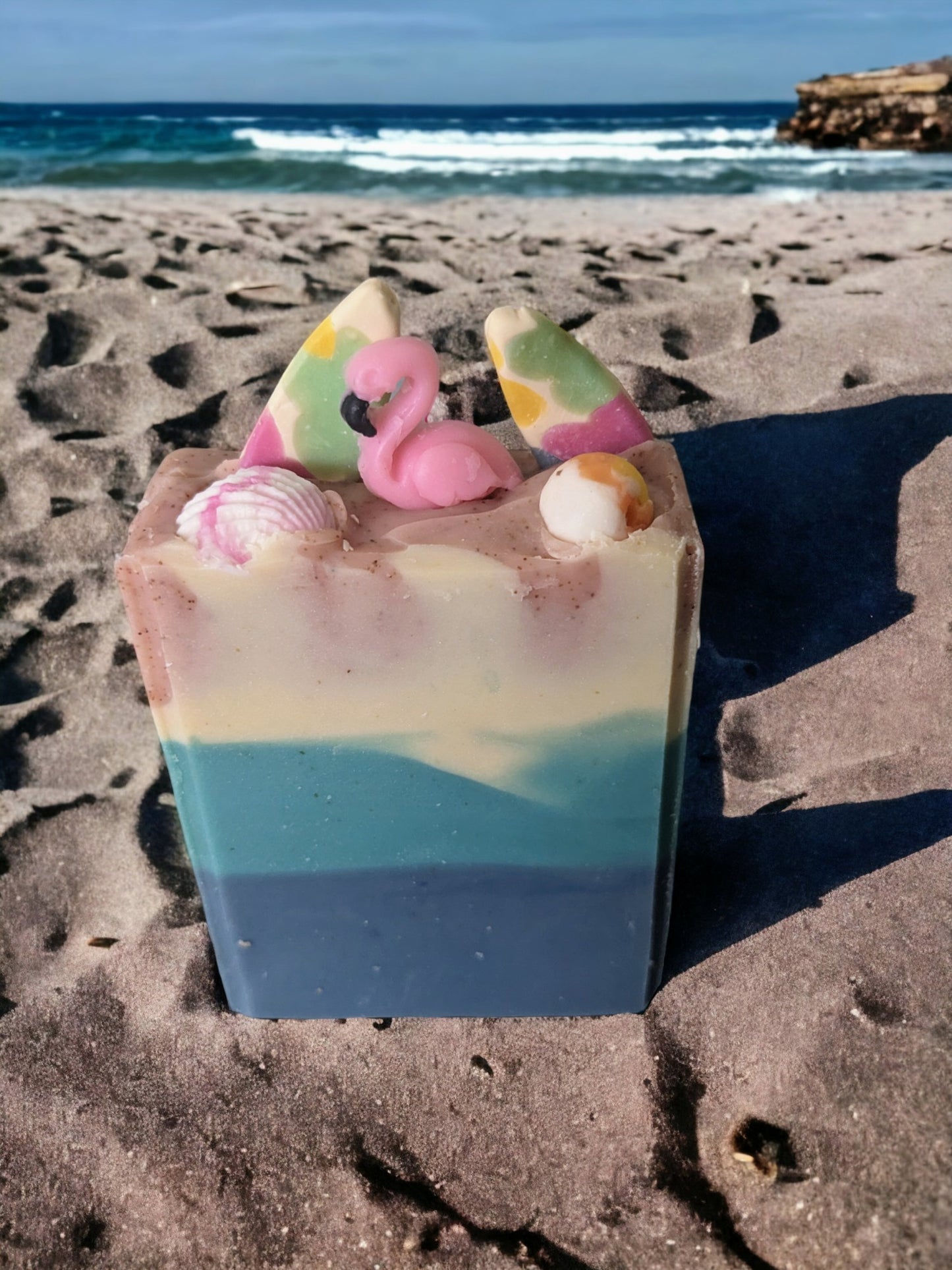 Luxurious beach themed butter soap bar with delightful beach decorations like Pink Flamingos, Palm Trees, surf boards sea shells and beachballs. Scented with Pink Sangria.  TThis soap was inspired by Pink Sands Beach in the Bahamas.