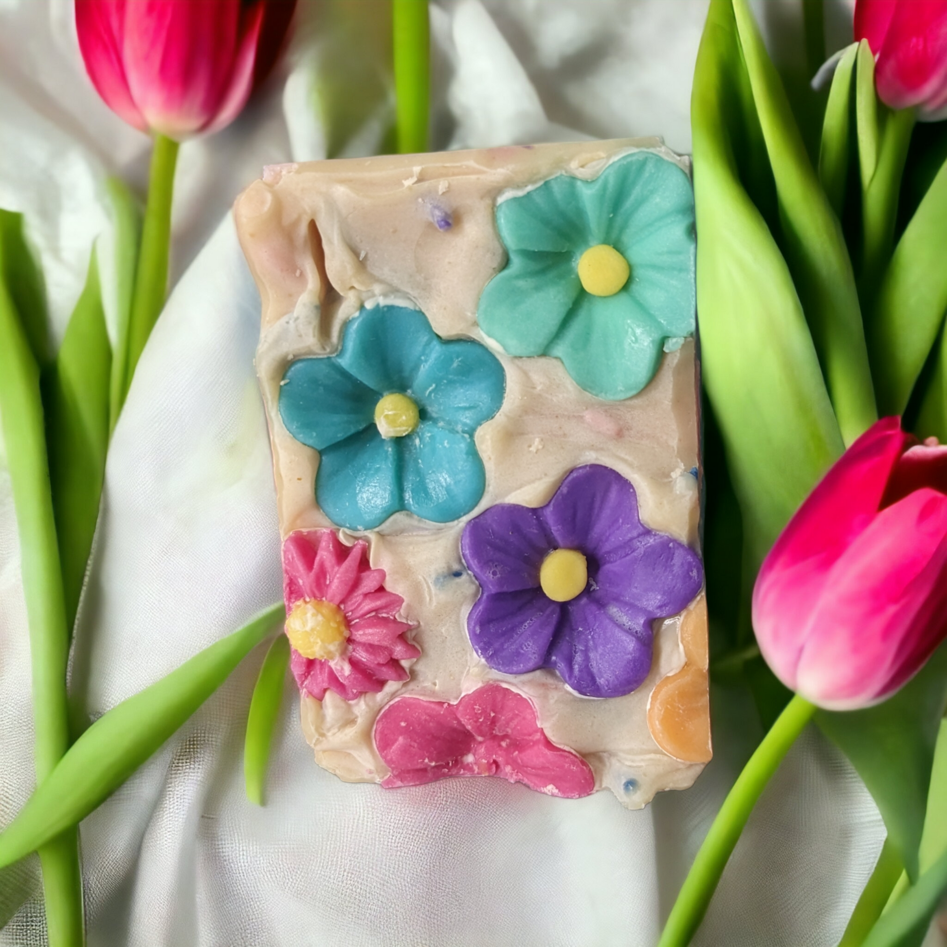 Take a cheery escape with our Floral Fiesta soap! Loaded with skin loving ingredients, this delightful soap is topped with florals, has multi-colored soap sprinkes throughout and flowers that go side to side.  The scent is off the charts with a Coco Mademoiselle like fragrance oil.  So tantalize your senses with scent filled bubble and a kaleidoscope bar of blooms that'll have you feelin' as revitalized as a siesta, so you can rock your Fiesta all day long