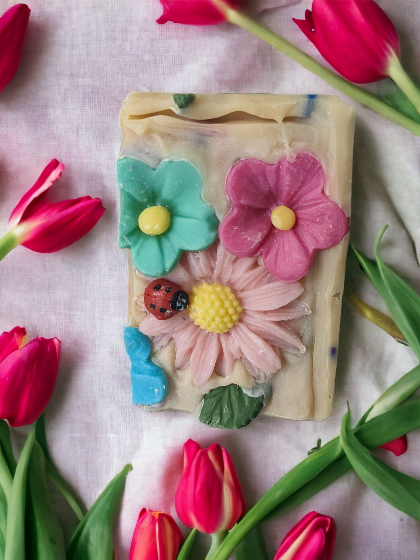 Take a cheery escape with our Floral Fiesta soap! Loaded with skin loving ingredients, this delightful soap is topped with florals, has multi-colored soap sprinkes throughout and flowers that go side to side.  The scent is off the charts with a Coco Mademoiselle like fragrance oil.  So tantalize your senses with scent filled bubble and a kaleidoscope bar of blooms that'll have you feelin' as revitalized as a siesta, so you can rock your Fiesta all day long