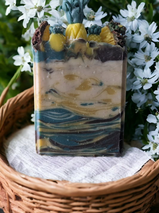 Handmade, decorative Pineapple Paradise soap bar! A real treat for your senses, this luxurious soap top is decorated with pineapples and pineapple slices -- all soap of course! This 4 butter luxurious soap bar delightfully refreshing pineapple-cilantro scent. For a tropical shower experience you won't soon forget, this is one blissful bar!