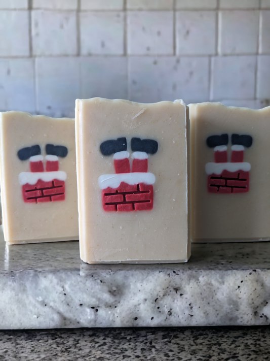 Get in the Christmas spirit with Delayed Delivery! – the perfect piece for your holiday decor. Scented with Peppermint Stick fragrance oil, this delightful tallow soap features an embed of Santa Santa stuck in a chimney with his feet in the air.  The embed is throughout the entire width of the soap.  This handcrafted, decorative soap will make your daily washing a tad more cheerful and merry. 