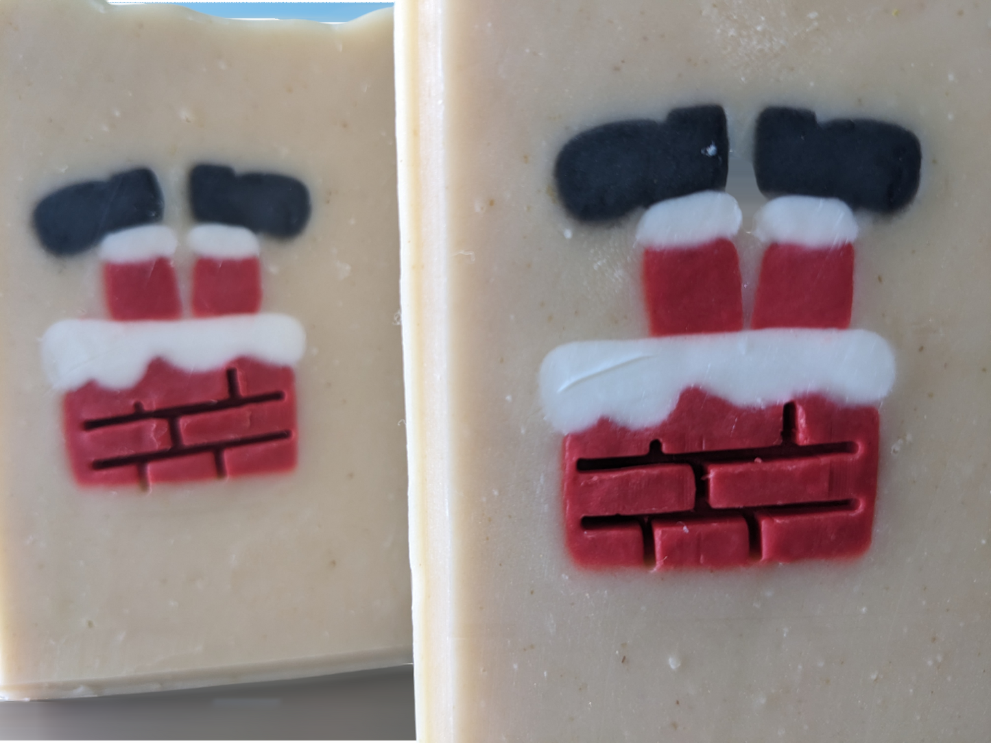 Christmas soap scented with Peppermint Stick fragrance oil. This delightful holiday tallow soap features an embed of Santa Santa stuck in a chimney with his feet in the air.  The embed is throughout the entire width of the soap.  This handcrafted, decorative soap will make your daily washing a tad more cheerful and merry.