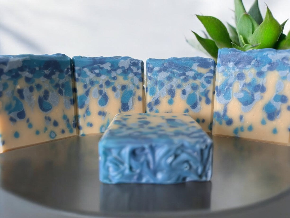 Bubbly goat milk soap scented with Black Raspberry Vanilla. Handcrafted with blue drop swirls on a cream base, evoking ocean water or sea pearls. Enriched with Goat Milk, Kaolin Clay, and Colloidal Oats for a rich, bubbly lather. Perfect addition to your shower products.