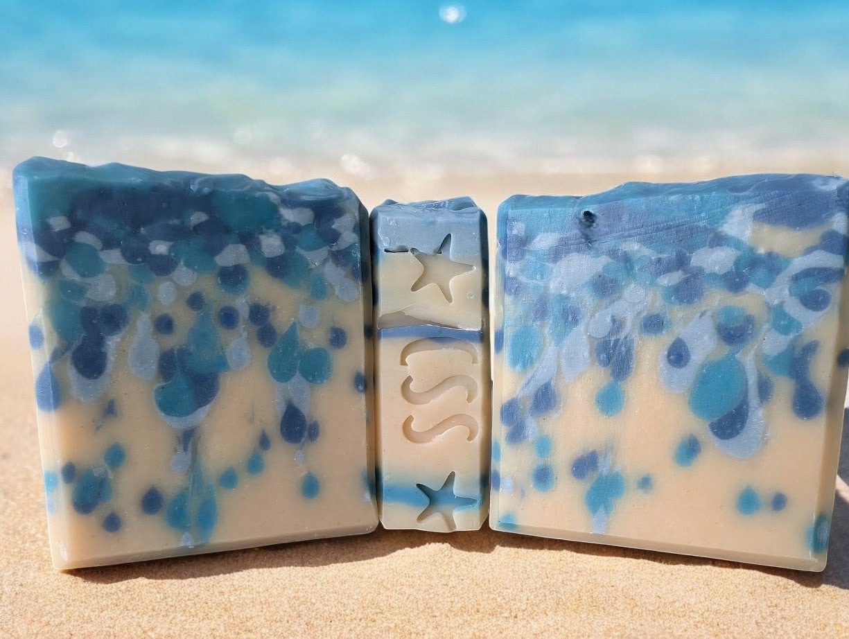 Bubbly goat milk soap scented with Black Raspberry Vanilla. Handcrafted with blue drop swirls on a cream base, evoking ocean water or sea pearls. Enriched with Goat Milk, Kaolin Clay, and Colloidal Oats for a rich, bubbly lather. Perfect addition to your personal care routine.