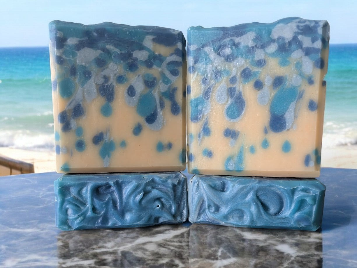 Bubbly goat milk soap scented with Black Raspberry Vanilla. Handcrafted with blue drop swirls, evoking ocean water or sea pearls. Enriched with Goat Milk, Kaolin Clay, and Colloidal Oats for a rich, bubbly lather. Perfect for body and hand washing.