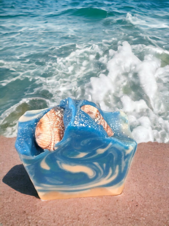 Fun beach-themed soap bar.  Handcrafted with all-natural, nourishing butters like shea, cocoa, mango and kokum. The fun soapy decorations include realistic sea shells and bright colors that will transport you right to the Caribbean, no matter where you are! Enjoy a luxurious, 'Coconut Paradise' fragrant lather each time you wash, and get ready to treasure the summer vibes all year round.