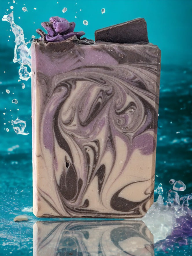 Artisan chocolate-lavender butter soap bar! Handcrafted with divine whispy swirls, and topped with soap roses and chocolate, your skin will feel as smooth as the butters it's created with.  Scented with a divine chocolate and lavender fragrance!  This butter bar is a must buy, must try!