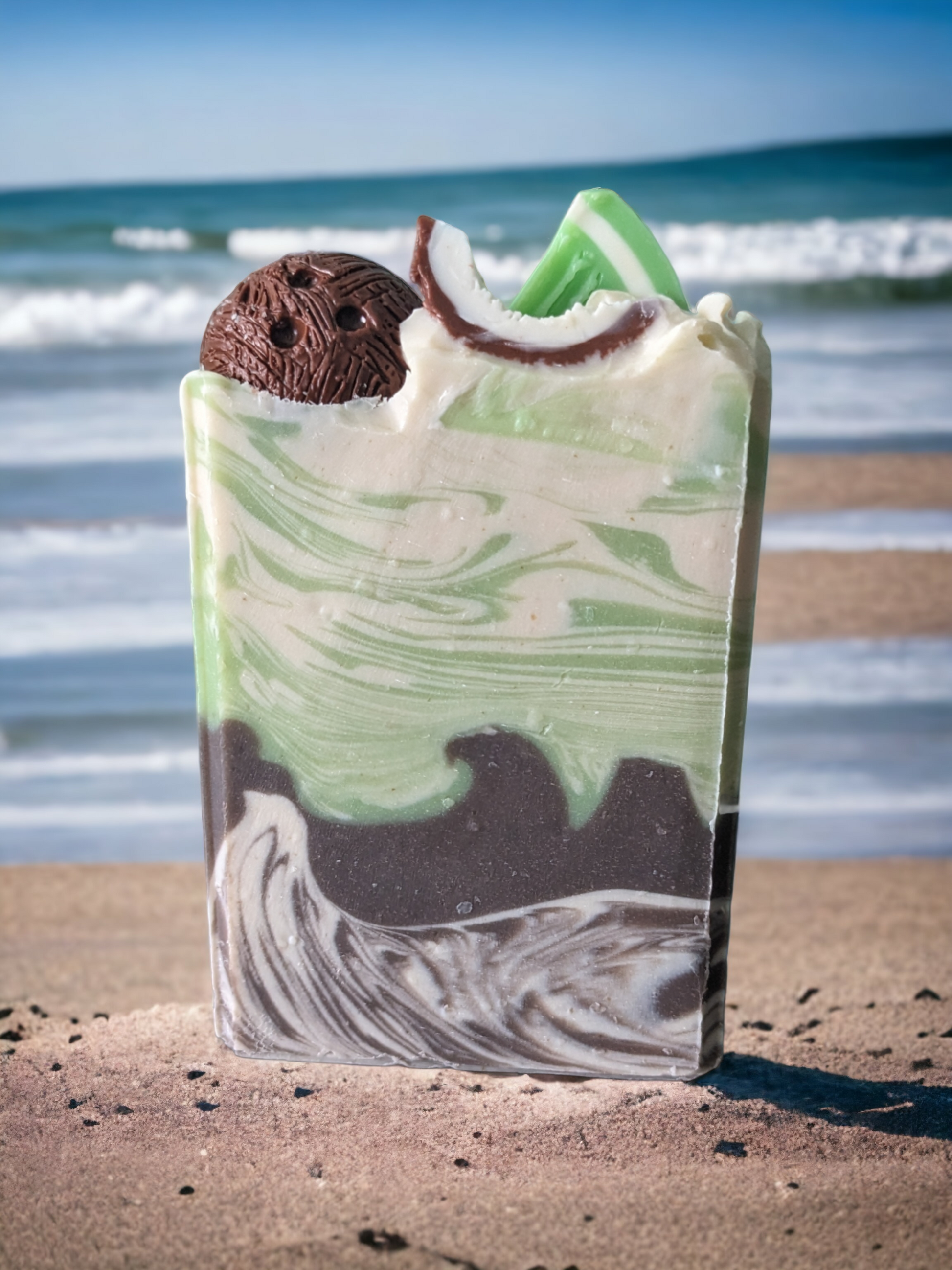 Delightfully scented with Coconut Lime Verbena, and loaded with skin loving ingredients like cocoa, shea, mango and kokum butters, this tropical themed soap will have you dreaming of exotic places!Delightfully scented with Coconut Lime Verbena and topped with a half coconut and quarter coconut shells and a lime.