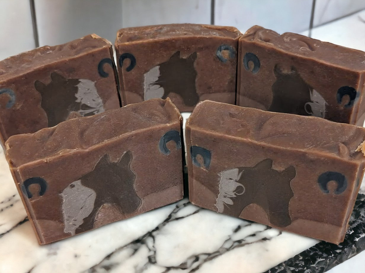 Soap featuring Horse head silhouette against a two tone brown background. This unique soap is the perfect personal care gift for a horse lover.  Lovingly crafted with top-notch ingredients like goat milk and colloidal oats.