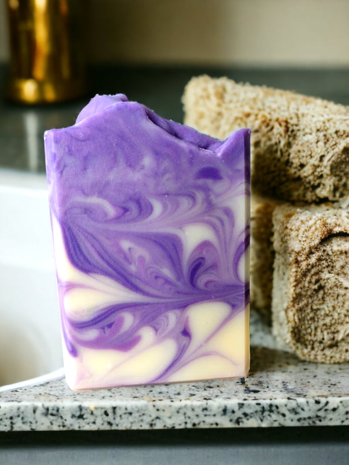 Lovingly handcrafted this decorative soap bar contains the finest soap making butters that Mother Nature has to offer.  Lightly scented with lavender essential oil and delicate swirls in shades of purple and cream, you'll be feeling fresh and fabulous after every use!👌